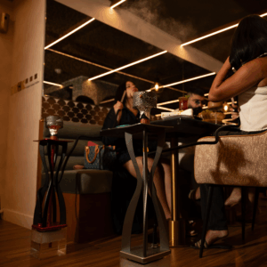 Guests enjoying luxury dining experience in modern stylish restaurant interior