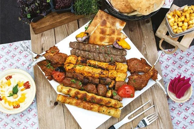 A plate of different kebabs, chicken and beef