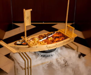 A generous mixed seafood platter with prawns, lobster, mussels and grilled fish, beautifully arranged at Villamoura Dubai.