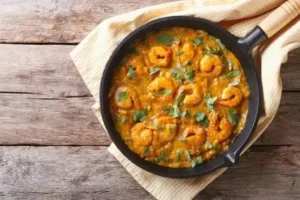 Mozambican Prawn Curry: The Coastal Dish Behind the Flame-Grill